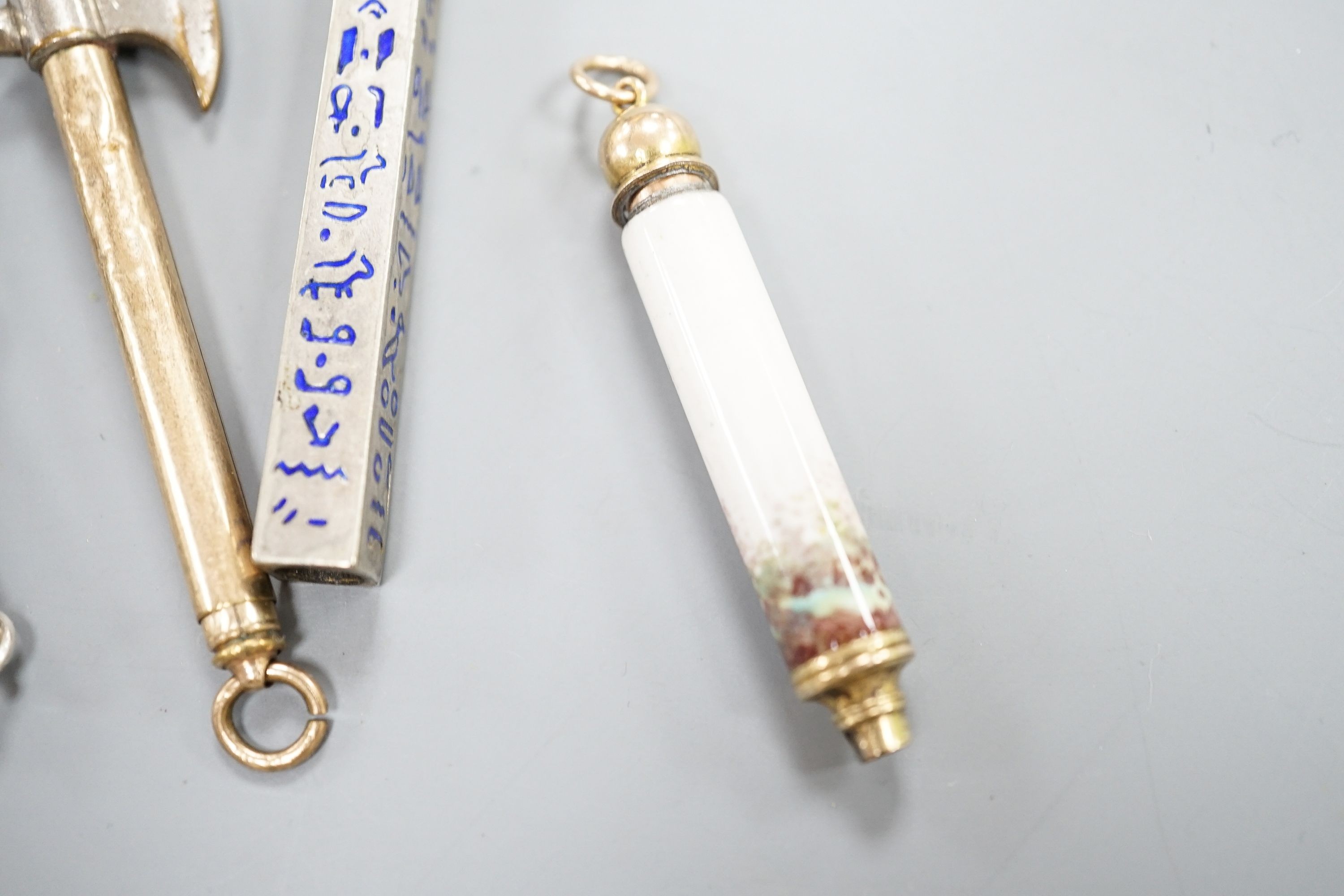 Four assorted pencils, including three enamelled and novelty modelled as an axe